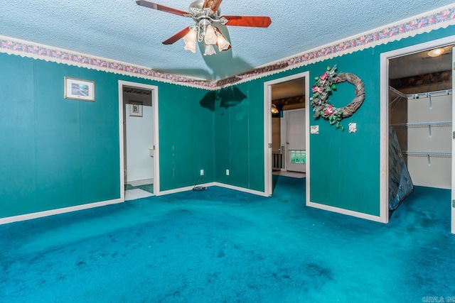 unfurnished bedroom with carpet, ceiling fan, a textured ceiling, and a closet