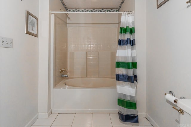 bathroom with shower / bath combo and tile patterned floors