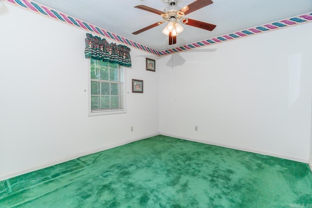 spare room with ceiling fan, carpet floors, and a textured ceiling