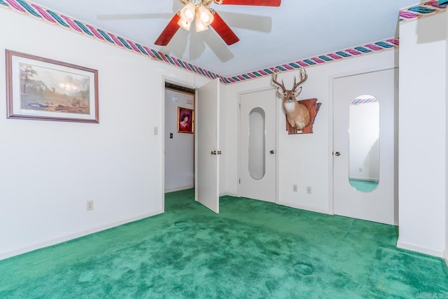 unfurnished bedroom featuring carpet flooring and ceiling fan