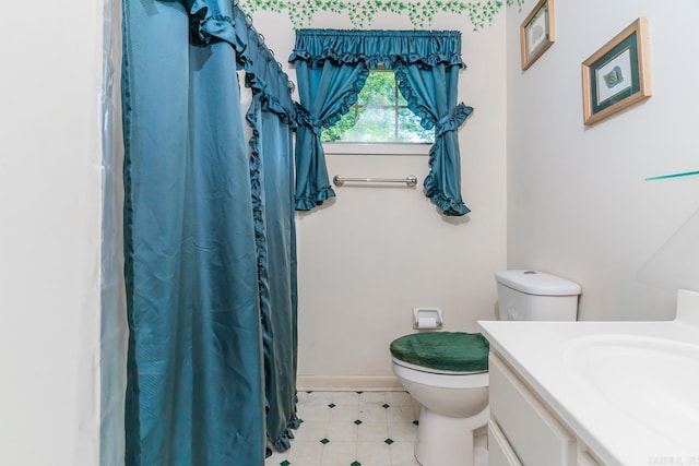 bathroom featuring vanity and toilet