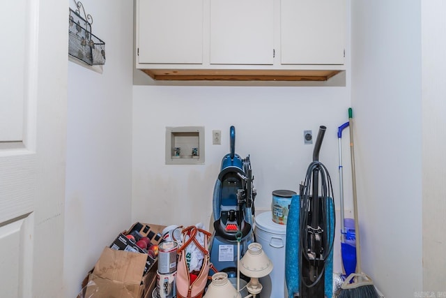 laundry area with cabinets, hookup for a washing machine, and electric dryer hookup