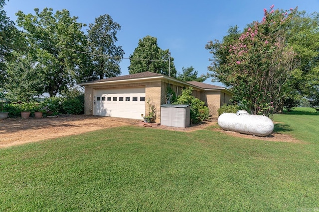 ranch-style house with a front yard and a garage