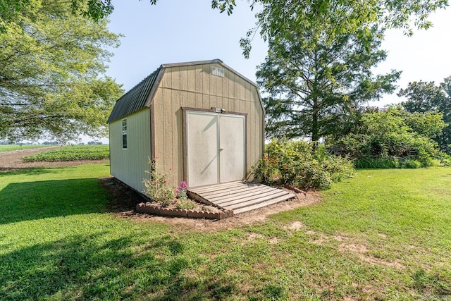 view of outbuilding with a lawn