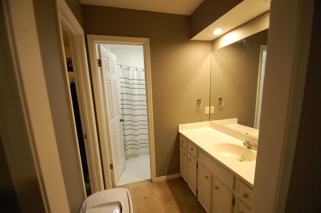 bathroom featuring vanity and curtained shower