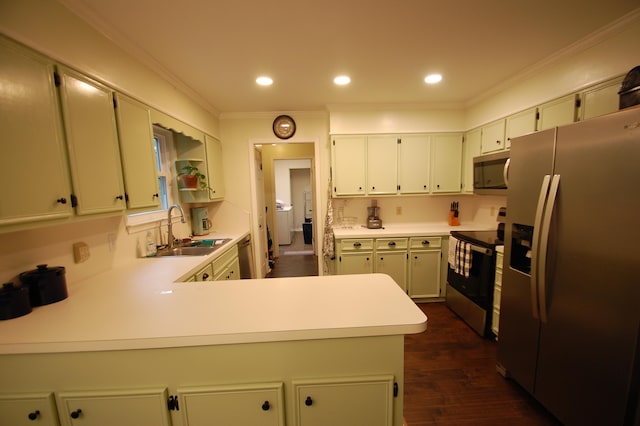 kitchen featuring dark hardwood / wood-style floors, sink, kitchen peninsula, stainless steel appliances, and crown molding