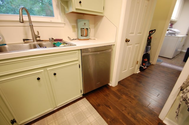 kitchen with dark hardwood / wood-style floors, dishwasher, sink, and washer / dryer