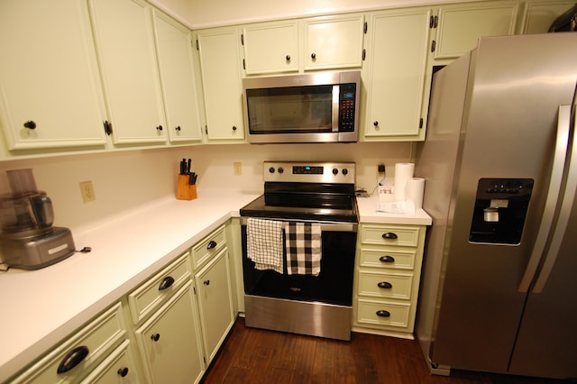 kitchen with dark wood-type flooring and stainless steel appliances