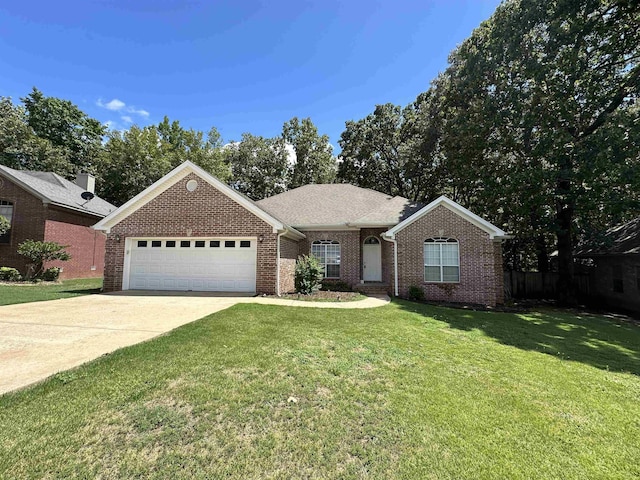 ranch-style house featuring a garage and a front lawn