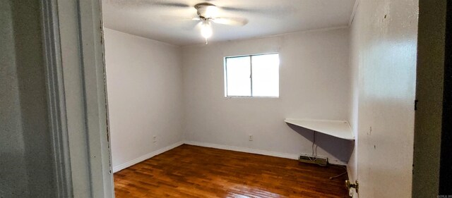 unfurnished room with dark hardwood / wood-style floors