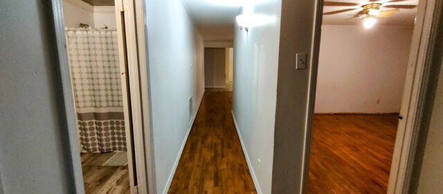 corridor featuring hardwood / wood-style flooring