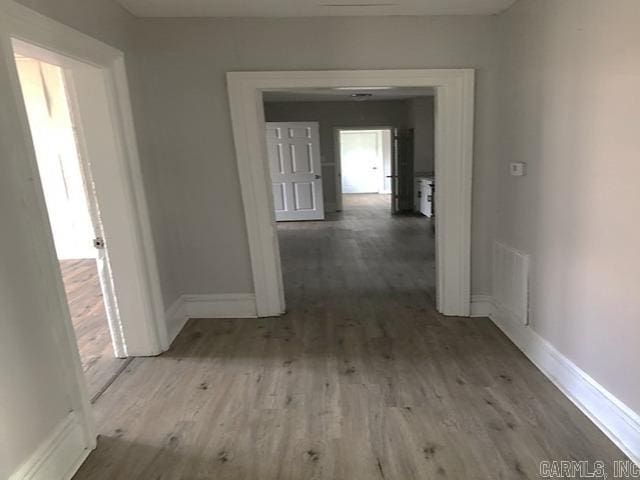 hallway featuring light wood-type flooring