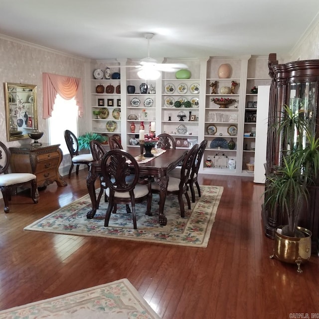 dining space featuring ceiling fan and dark hardwood / wood-style flooring