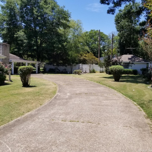 surrounding community featuring a yard