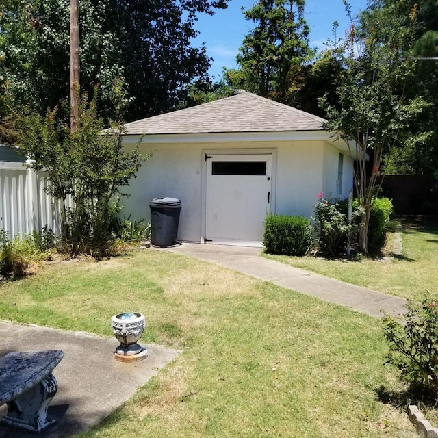 view of outdoor structure featuring a lawn