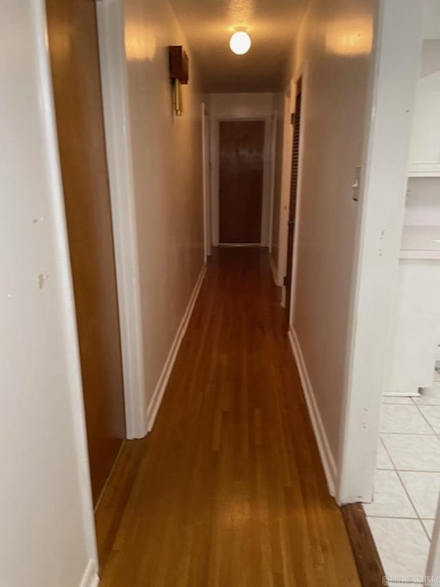 corridor with light wood-type flooring