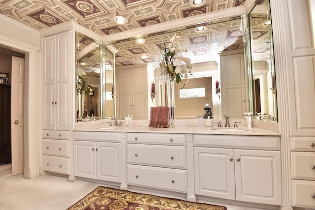 bathroom featuring crown molding and vanity