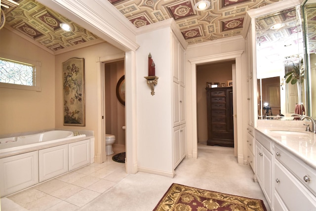 bathroom featuring ornamental molding, toilet, vanity, and a washtub