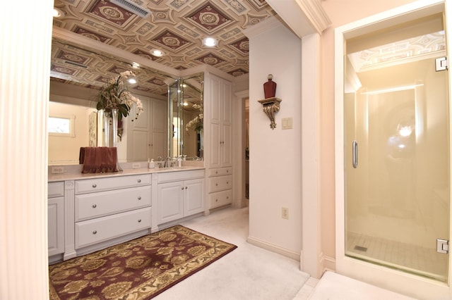 bathroom featuring vanity and a shower with shower door