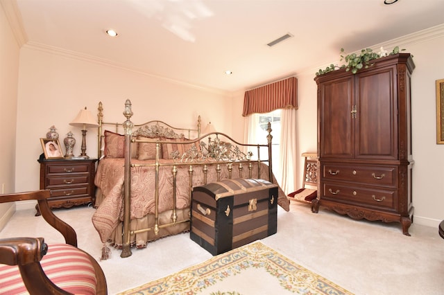 bedroom with crown molding and light colored carpet