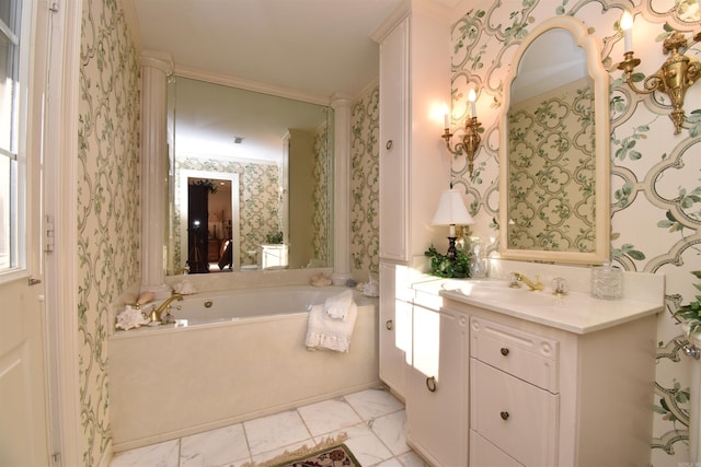 bathroom with crown molding, vanity, and a bath