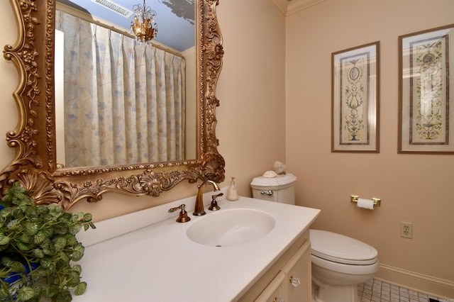 bathroom featuring vanity and toilet