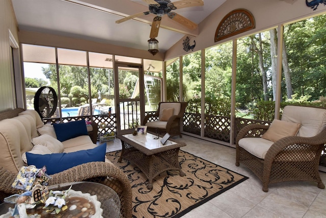 sunroom / solarium with lofted ceiling and ceiling fan