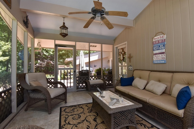 interior space featuring vaulted ceiling with beams and ceiling fan