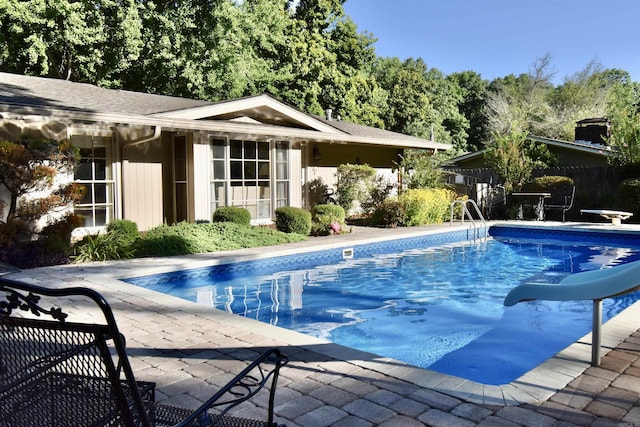 view of pool featuring an outdoor structure