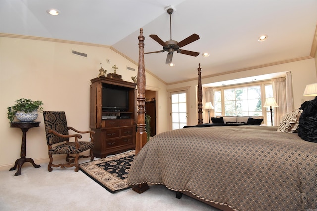 carpeted bedroom featuring vaulted ceiling, ornamental molding, and ceiling fan