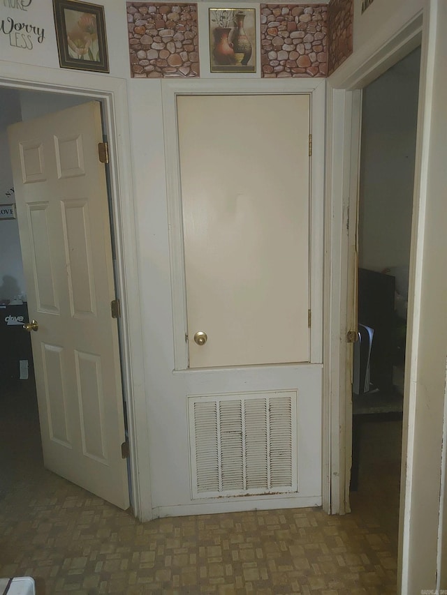 hall featuring tile patterned flooring