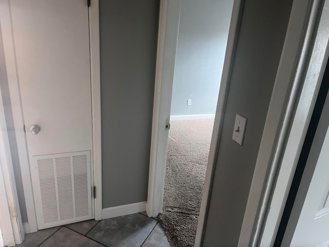 bathroom with tile patterned floors