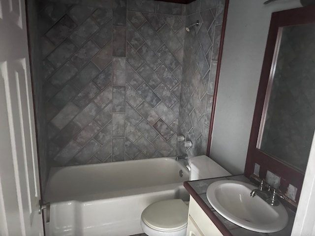 full bathroom featuring vanity, toilet, and tiled shower / bath