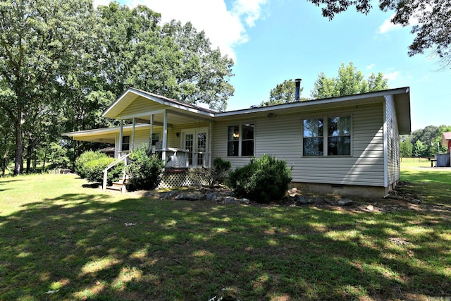 view of front of house with a porch and a front yard