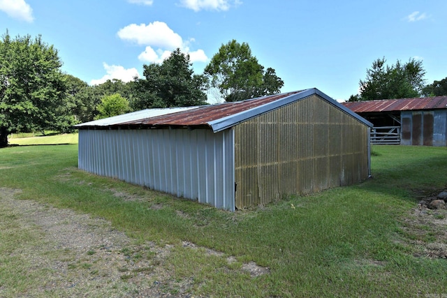 view of outdoor structure with a lawn