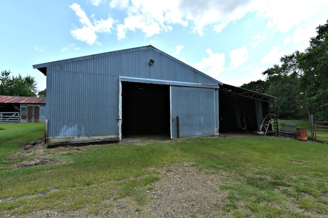 view of outdoor structure with a lawn