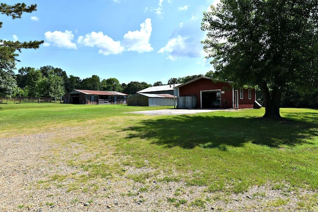 view of yard with an outdoor structure