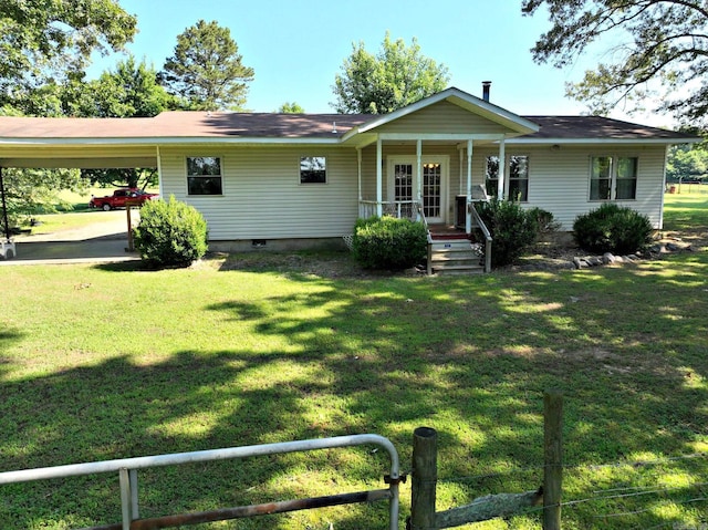 ranch-style home with a carport and a front yard