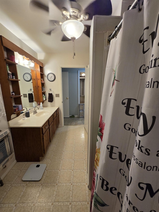 bathroom with ceiling fan, vanity, and a shower with shower curtain