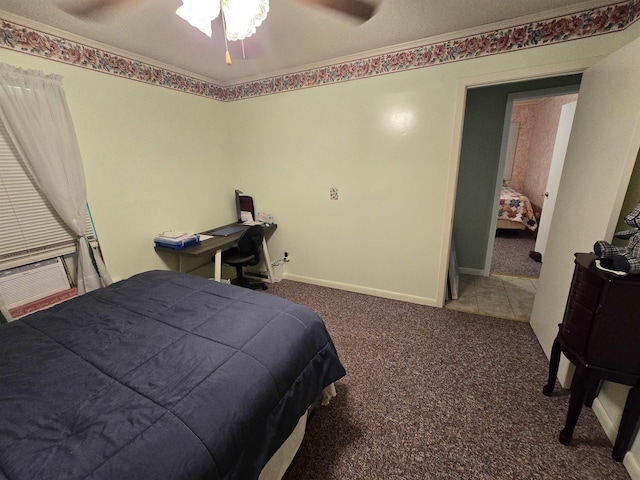 bedroom with cooling unit, carpet floors, and ceiling fan