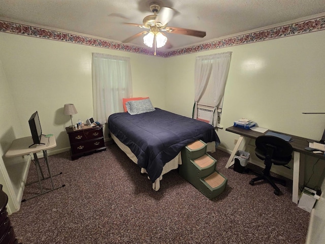 bedroom featuring ceiling fan, a textured ceiling, and dark colored carpet