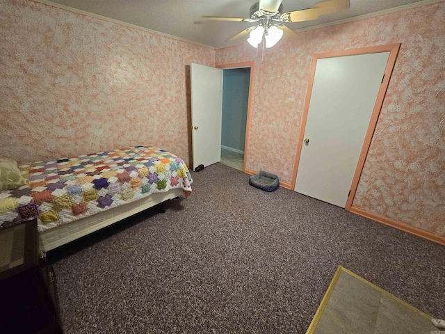 unfurnished bedroom featuring crown molding, ceiling fan, and carpet flooring