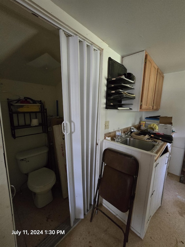 clothes washing area with sink