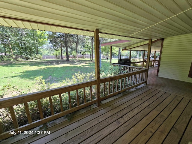 deck featuring a lawn