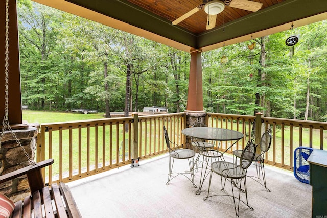 exterior space with a lawn and ceiling fan