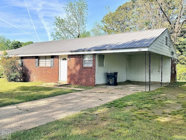 ranch-style home with a carport and a front yard