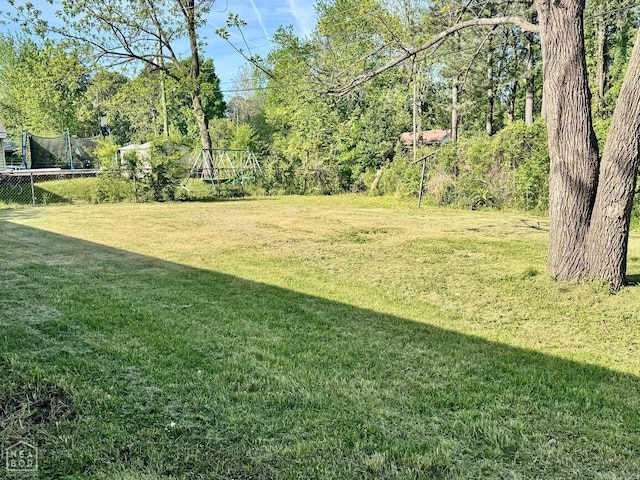 view of yard featuring a trampoline