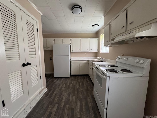 kitchen with white appliances, white cabinets, sink, crown molding, and dark hardwood / wood-style floors