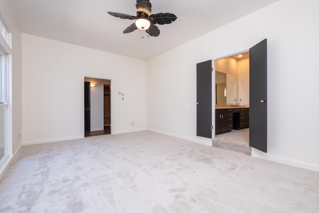 empty room with light carpet and ceiling fan