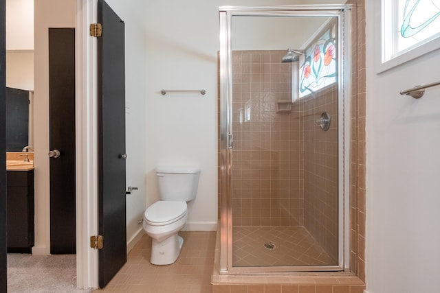 bathroom with sink, tile patterned floors, toilet, and a shower with door